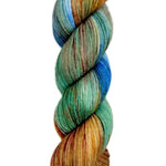 A skein of hand-dyed fingering/sock yarn color green orange blue red brown speckles