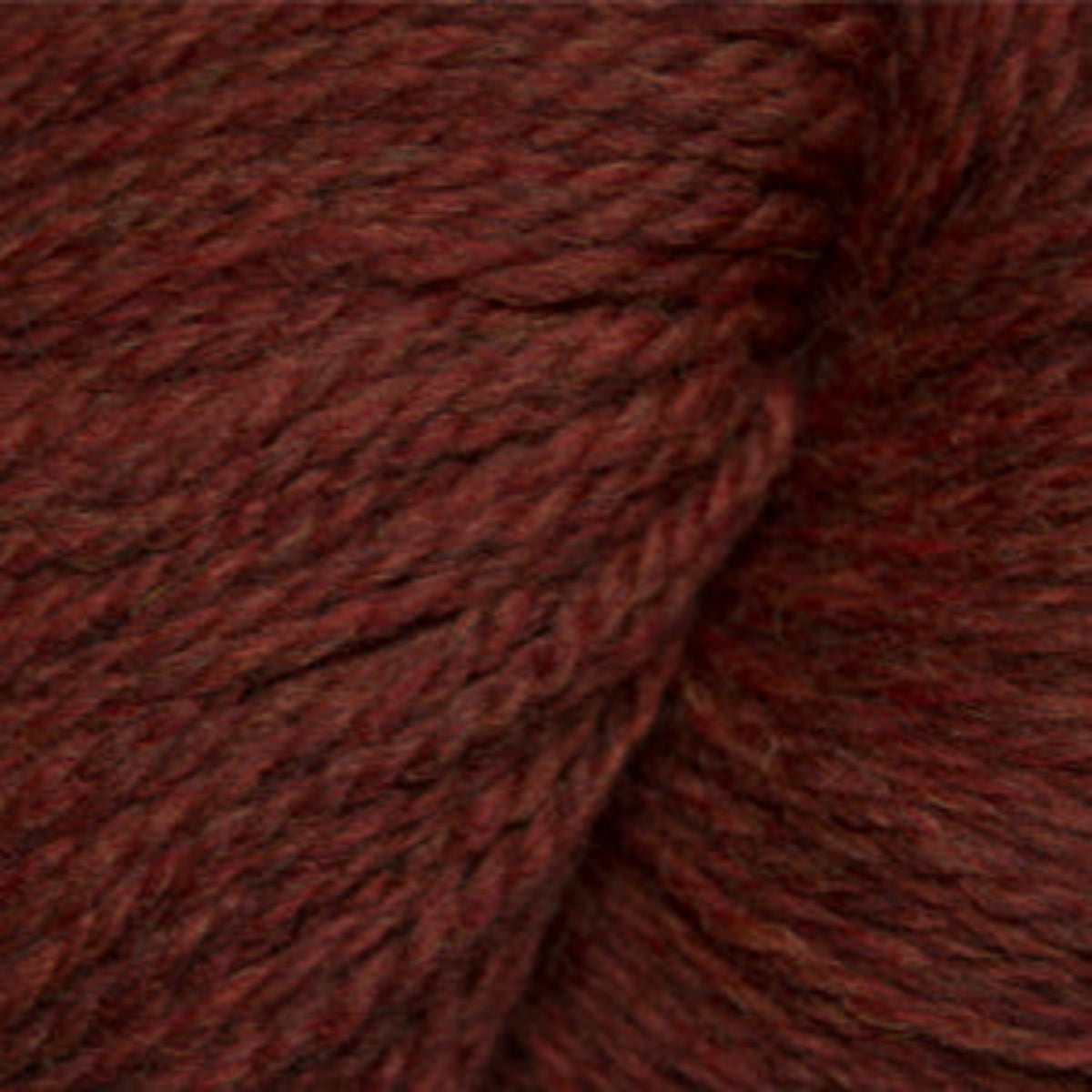 Close-up of a ball of dark brown yarn