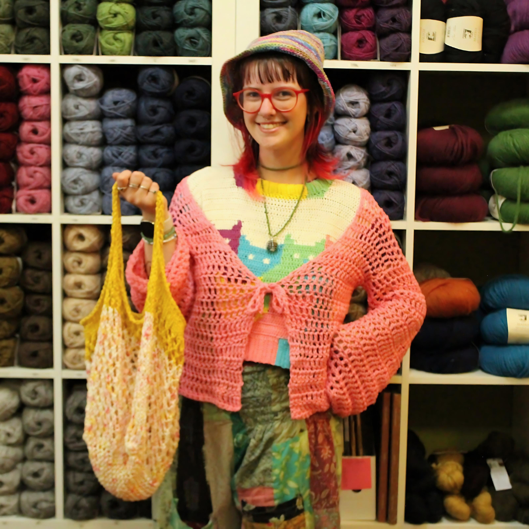 Ellie, one of Laramie's Crochet Queens showing off their latest projects.