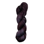 Purple  and grey skein of yarn on a white background