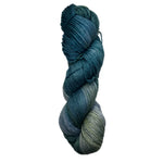 Blue and grey skein of yarn on a white background