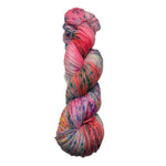 Multicolored skein of yarn on a white surface