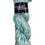 A skein of cotton yarn in the colors white teal and light blue