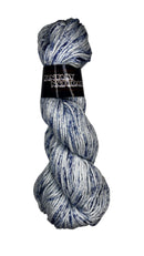 A skein of cotton yarn in the colors white with dark navy speckles