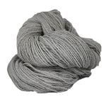 Light grey skein of fingering weight wool yarn 
