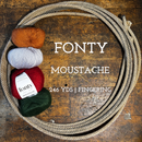 Balls of Fonty Moustache Fingering Weight Yarn in the colors orange grey red green on a wooden surface