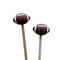 Two football-shapedstitch stoppers with smiling faces on knitting needles