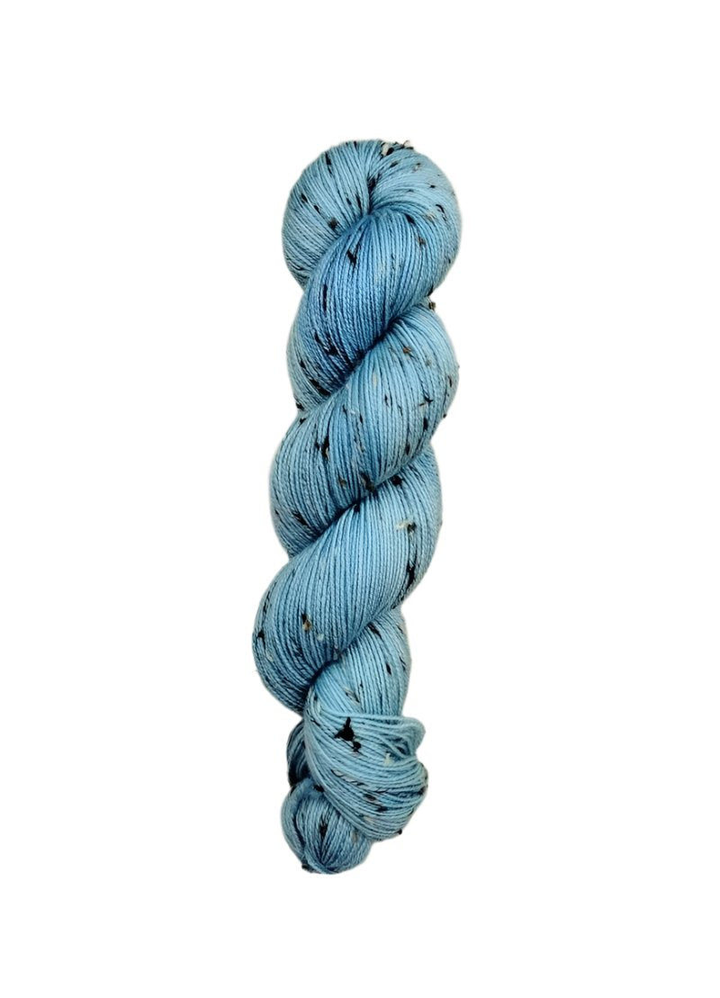 Skein of hand dyed BFL Tweed Yarn color sky blue
