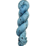 Skein of hand dyed BFL Tweed Yarn color sky blue