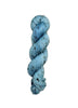Skein of hand dyed BFL Tweed Yarn color sky blue