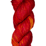 A skein of wool yarn in the color red, yellow and orange