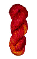 A skein of wool yarn in the color red, yellow and orange