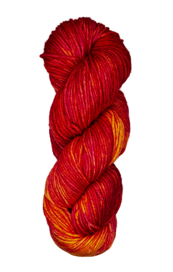A skein of wool yarn in the color red, yellow and orange