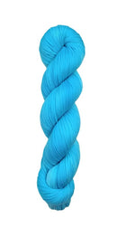 A skein of hand-dyed fingering/sock yarn color blue