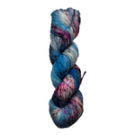 Multicolored skein of yarn on a white background