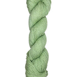 A skein of Mountain Meadow Wool Yarn in the color light green