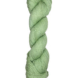 A skein of Mountain Meadow Wool Yarn in the color light green
