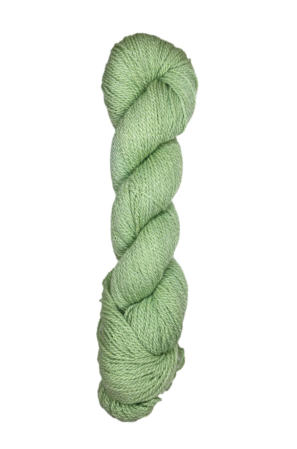 A skein of Mountain Meadow Wool Yarn in the color light green