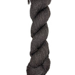 A skein of Mountain Meadow Wool Yarn in the color dark brown