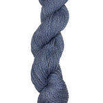 A skein of Mountain Meadow Wool Yarn in the color denim blue