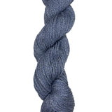 A skein of Mountain Meadow Wool Yarn in the color denim blue