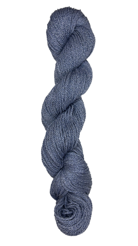 A skein of Mountain Meadow Wool Yarn in the color denim blue