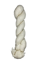 A skein of Mountain Meadow Wool Yarn in the color natural