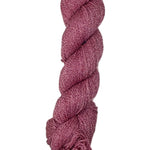 A skein of yarn in a berry red color
