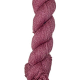 A skein of yarn in a berry red color