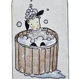 Small rectangular tin with a cartoon design of a sheep in a wooden bathtub on a white background