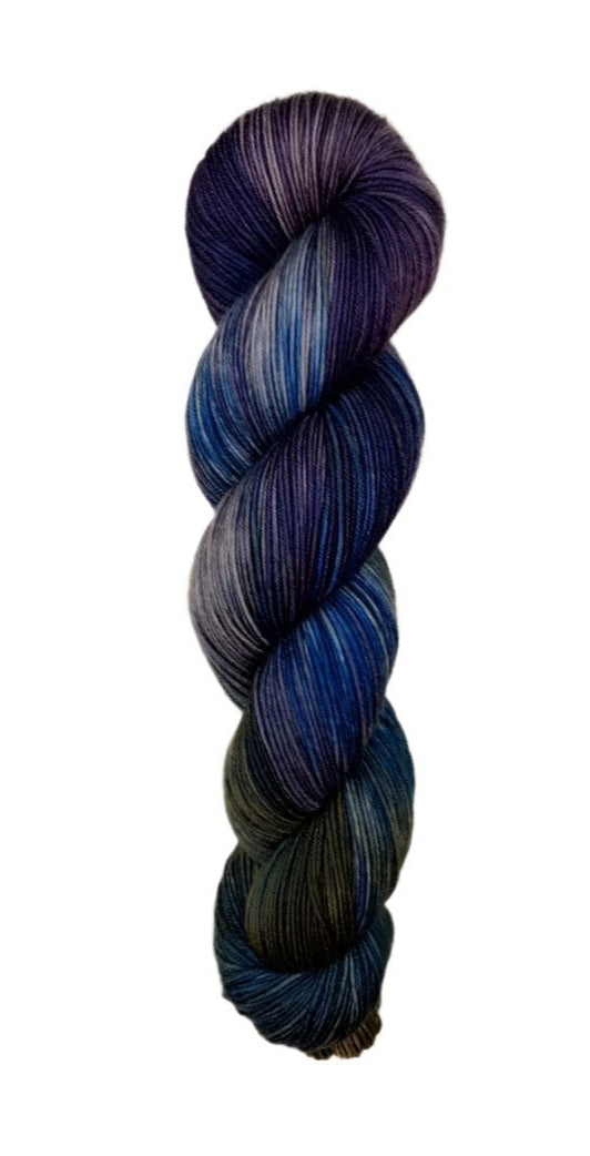 A skein of hand-dyed fingering/sock yarn color grey navy brown purple 