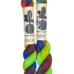 Two mini skeins of wool yarn hand dyed in Wyoming in the color green yellow blue orange purple