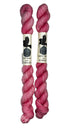 Mini Skeins of Hand Dyed yarn in the color bubblegum pink