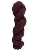 Wine colored skein of mountain meadow wool yarn on a white background