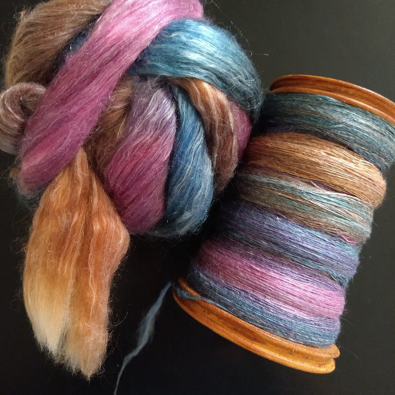 Fiber roving with a bobbin full of spun yarn
