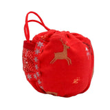 A red fabric drawstring pouch with a side mesh pocket decorated with white snowflakes, featuring a tan embroidered reindeer on the front.