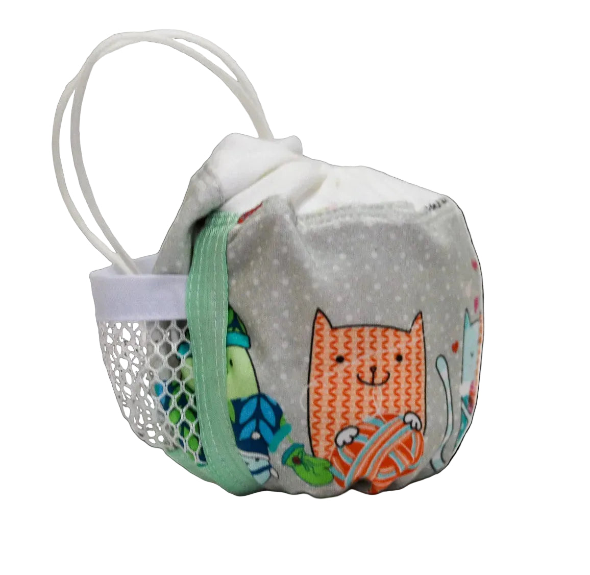 A small fabric pouch with a white handle, featuring a gray polka-dot body, and a colorful print of an orange cat and other cartoon characters on the front.