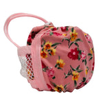 A pink fabric pouch in floral print, featuring a pink elastic strap and a white mesh pocket on the side.
