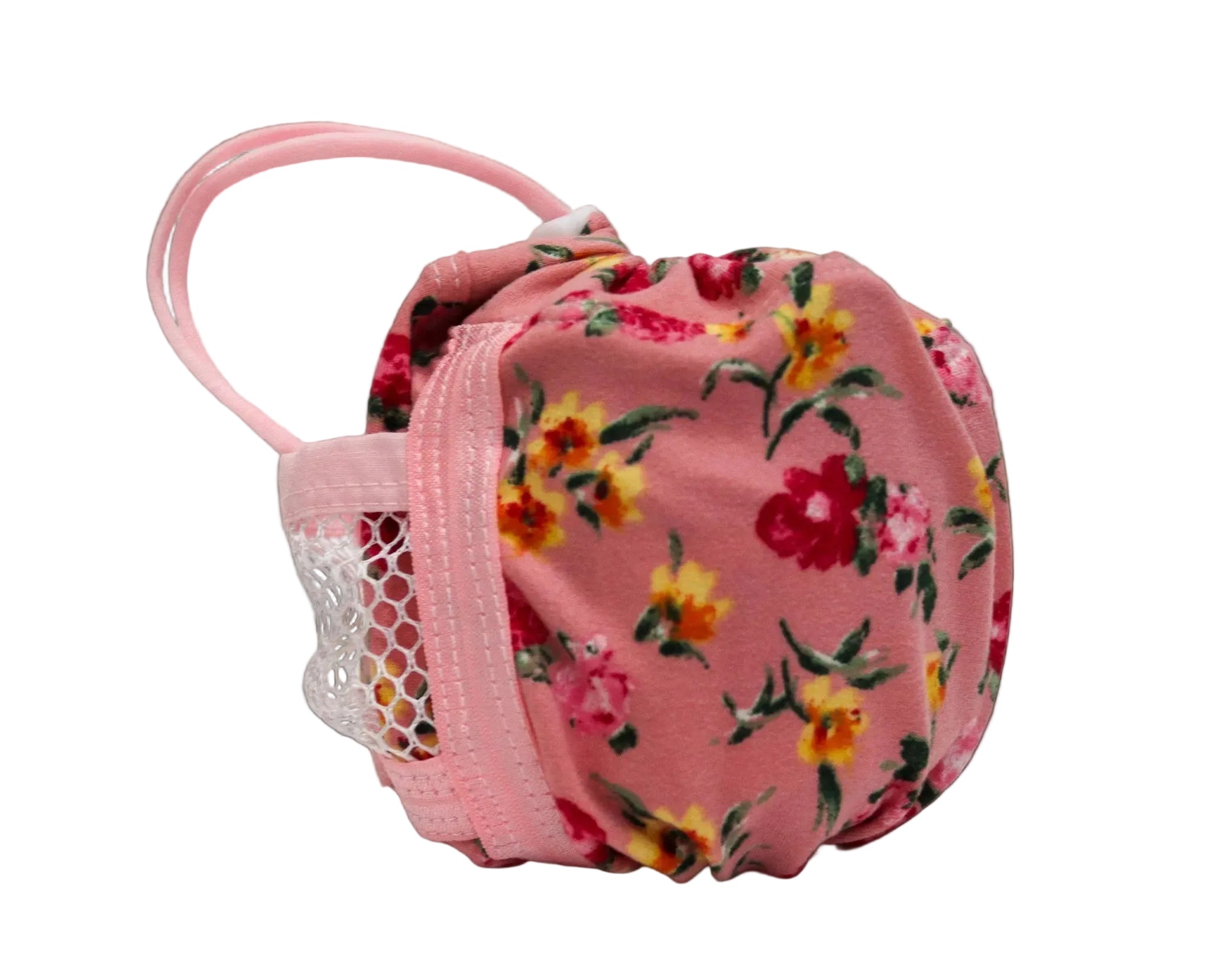 A pink fabric pouch in floral print, featuring a pink elastic strap and a white mesh pocket on the side.