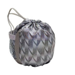 A small drawstring pouch with a metallic silver and gray geometric pattern, featuring a side mesh pocket and light gray drawstring cords, set against a plain white background.