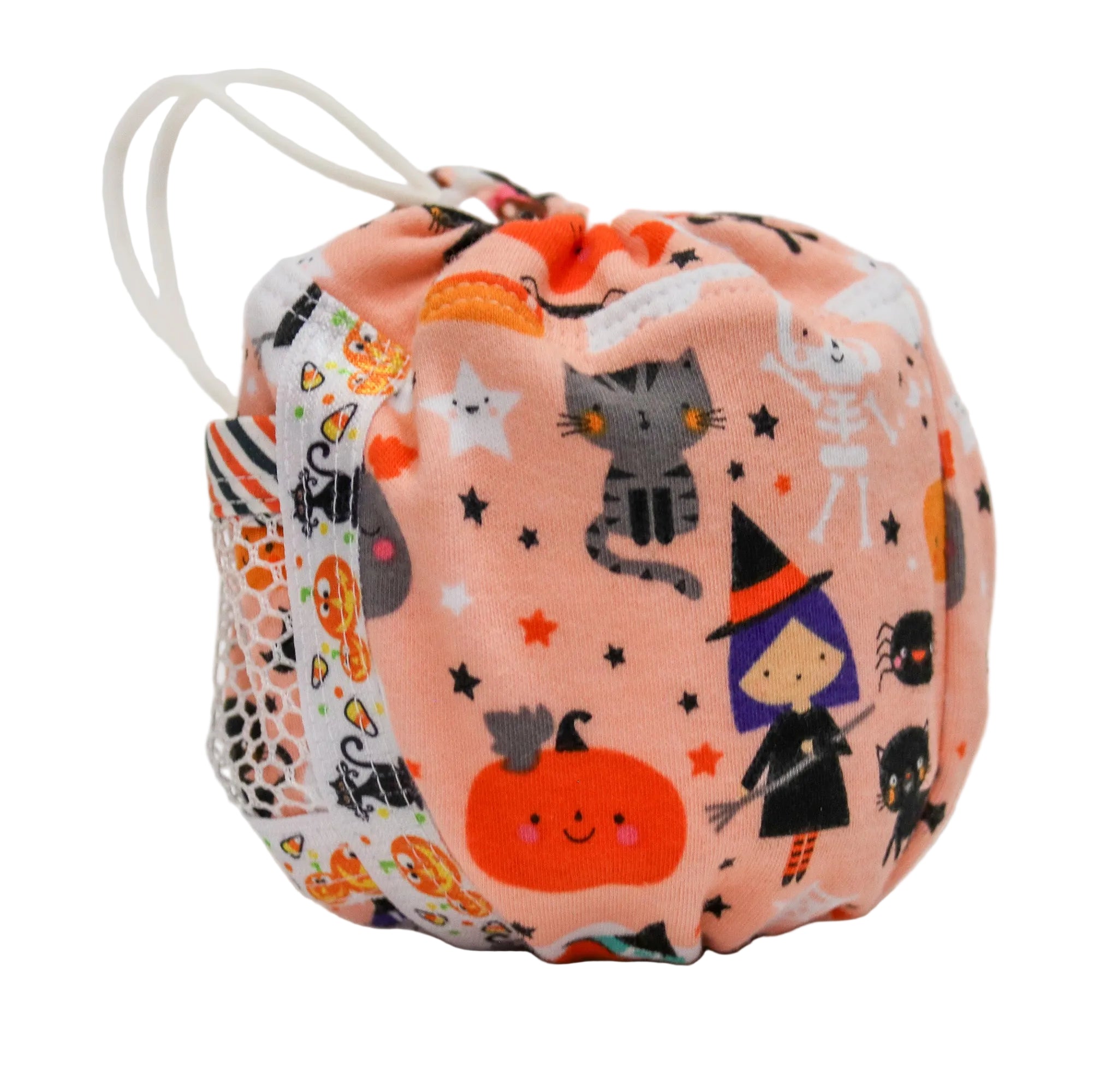 A small fabric drawstring bag with a Halloween print, featuring a peach-pink background with cartoon pumpkins, cats, witches, spiders, and stars, plus a white patterned side panel and white drawstring ties.