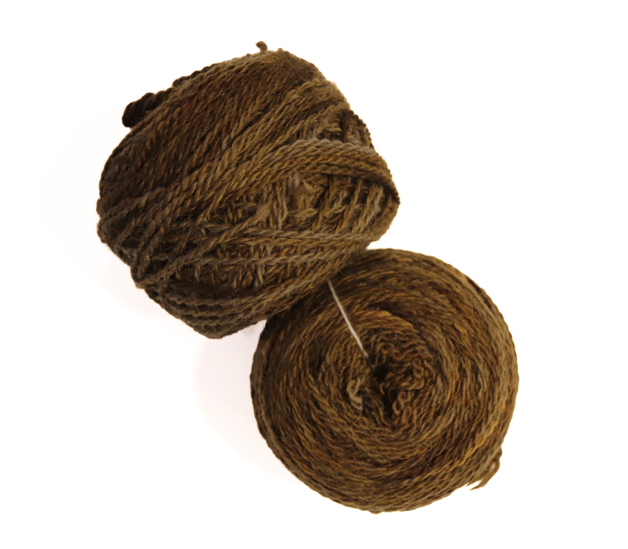 Two balls of thick, textured brown yarn on a plain white background.