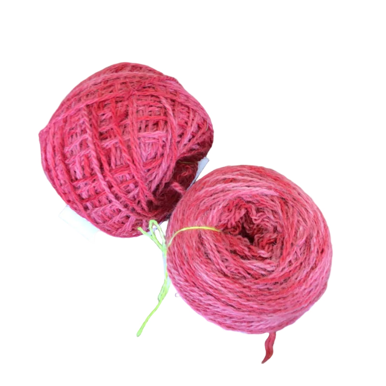 Two pink skeins of yarn on a white background