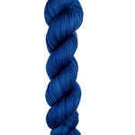 A skein of hand-dyed fingering/sock yarn color navy