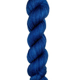 A skein of hand-dyed fingering/sock yarn color navy
