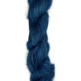 Skein of mohair silk yarn hand-dyed in Wyoming in the color blue
