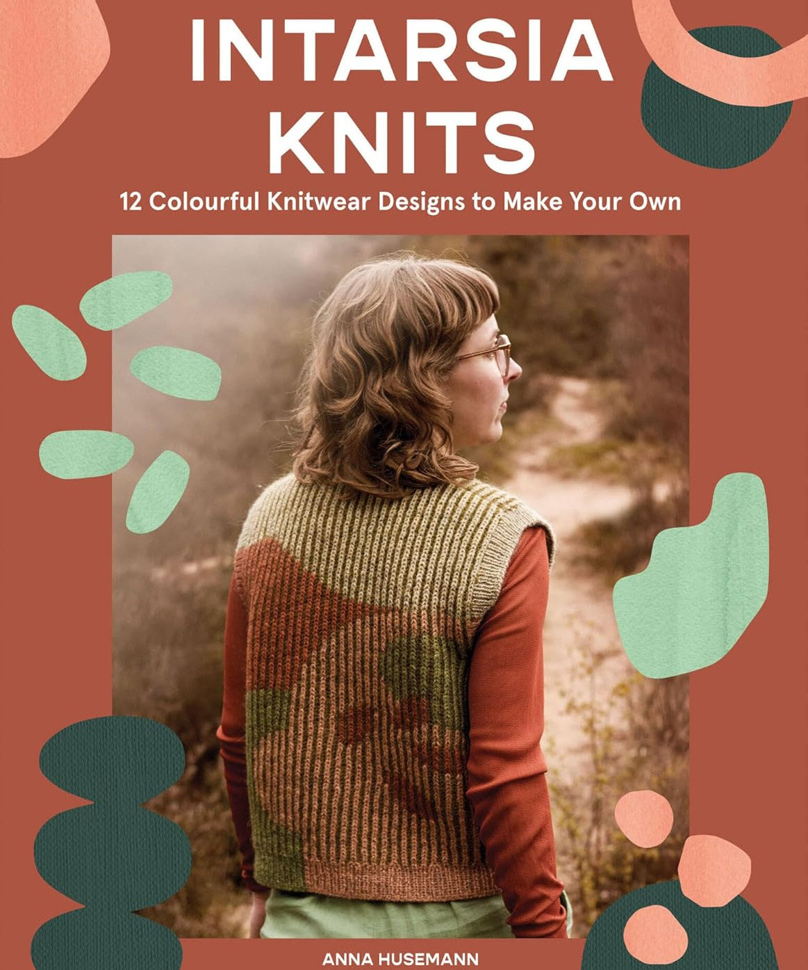 Book cover of 'Intarsia Knits' with a person wearing a knitted vest and colorful abstract shapes.