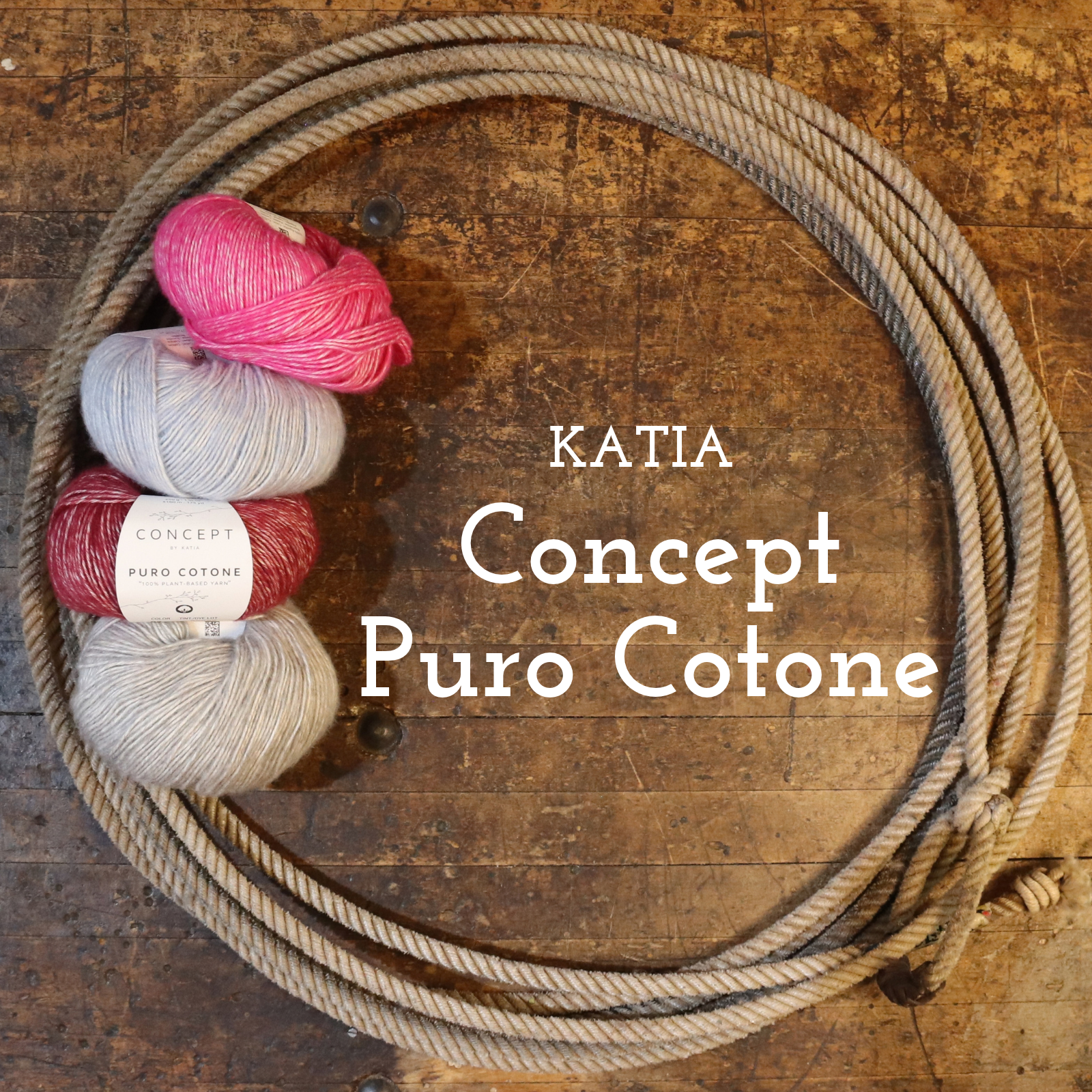 A coiled beige rope or cord arranged in a large circle on a rustic brown wooden surface, with four skeins of yarn in pink, light gray, burgundy, and cream placed on the left. White text reads 'KATIA Concept Puro Cotone.
