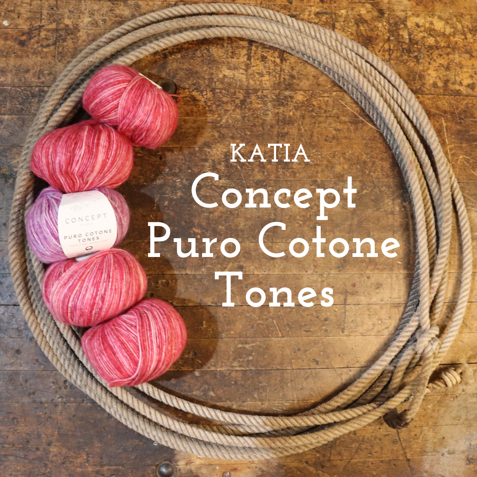 Four skeins of variegated yarn in pink, red, and purple shades arranged next to a coiled beige rope on a rustic wooden background, with the text 'KATIA Concept Puro Cotone Tones' overlaid in the center.