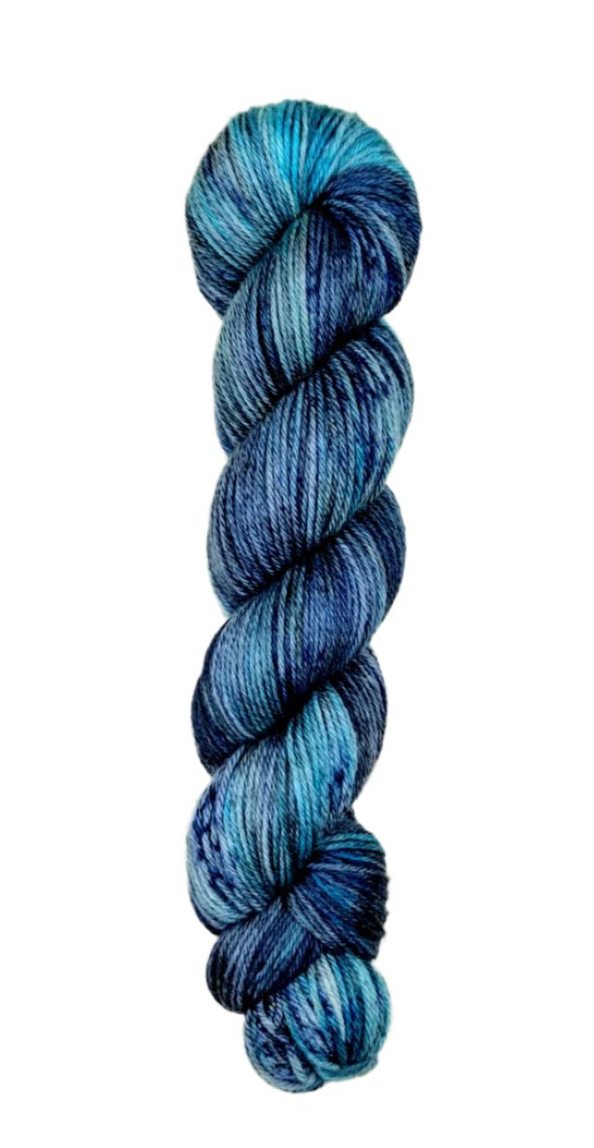 A skein of hand-dyed fingering/sock yarn color blue grey black speckles